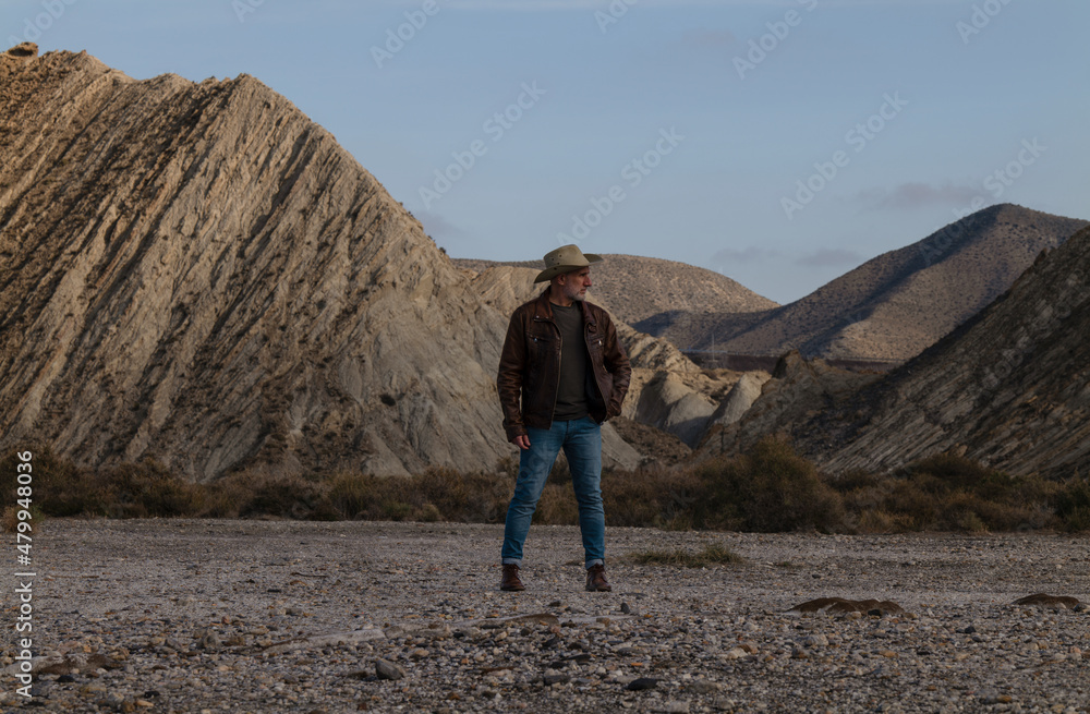 Adult man in cowboy hat in Tabernas Desert, Almeria, Spain
