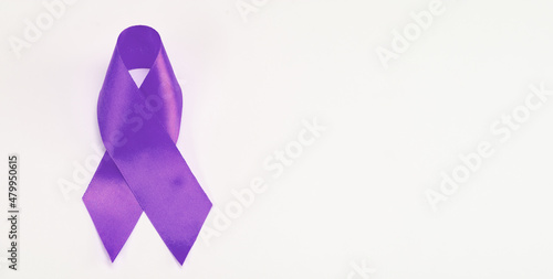 Purple awareness ribbon on white background. Cancer Fighting Challenges photo
