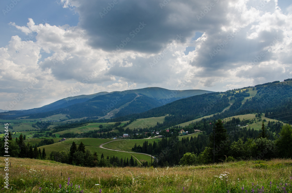 Mountain landscape. countryside landscape. beautiful views of the mountains in the summer. green trees and beautiful cloudy sky. Mountain landscape. countryside landscape. beautiful views of the mountains in the summer. green trees and beautiful cloudy sky.