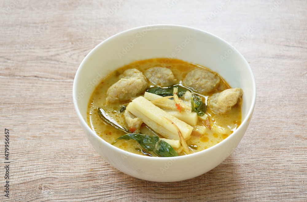 spicy boiled slice fresh coconut shoot with fish ball in green curry soup on bowl spicy boiled slice fresh coconut shoot with fish ball in green curry soup on bowl