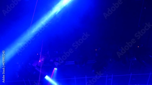 robotic laser and light play on the roof of a club