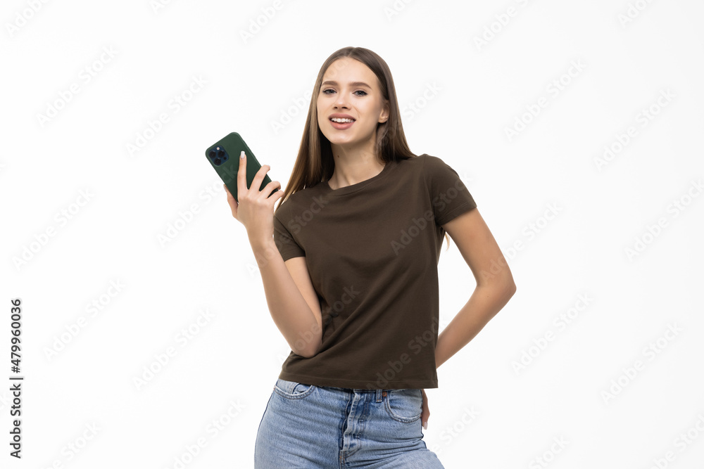 Portrait of smiling young pretty woman use smartphone isolated on white background Portrait of smiling young pretty woman use smartphone isolated on white background
