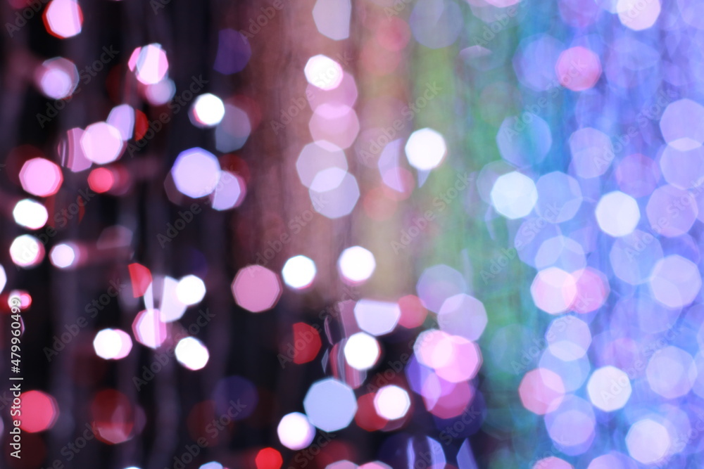 Colorful background of defocused glittering lights, Holidays background concept.