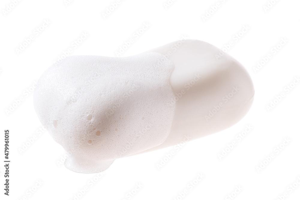A bar of soap with foam isolated on a white background. A bar of soap with foam isolated on a white background.
