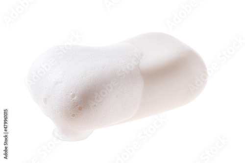 A bar of soap with foam isolated on a white background.