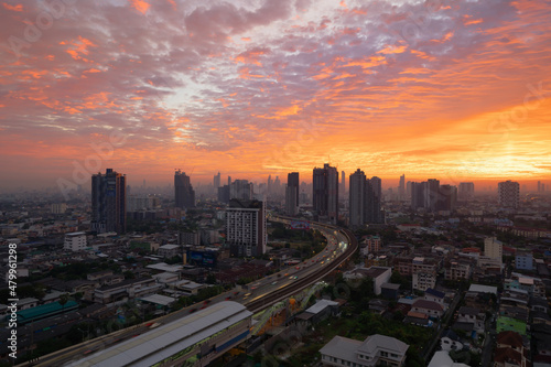Aerial view of highway street road at Bangkok Downtown Skyline  Thailand. Financial district and business centers in smart urban city in Asia.Skyscraper and high-rise buildings at sunset