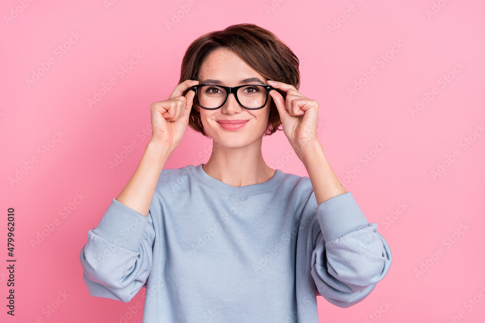 Photo of funny millennial brunette lady wear eyewear blue sportscloth isolated on pink color background Photo of funny millennial brunette lady wear eyewear blue sportscloth isolated on pink color background