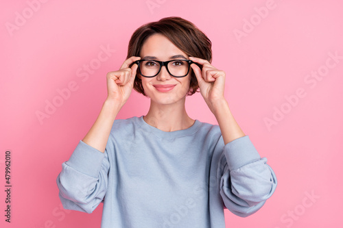 Photo of funny millennial brunette lady wear eyewear blue sportscloth isolated on pink color background