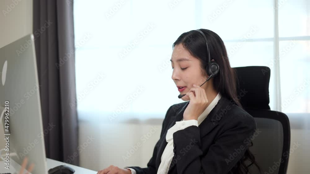 Call center smiley asian business woman receptionist wear headphone video conference calling on computer talk by webcam in online chat, customer support service. Call center smiley asian business woman receptionist wear headphone video conference calling on computer talk by webcam in online chat, customer support service.