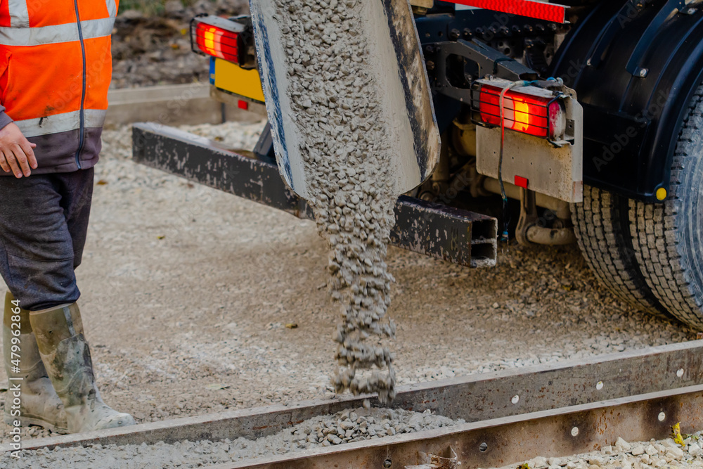 Wet ready mix concrete delivered on construction site and discarged of the vagon straight into formwork Wet ready mix concrete delivered on construction site and discarged of the vagon straight into formwork