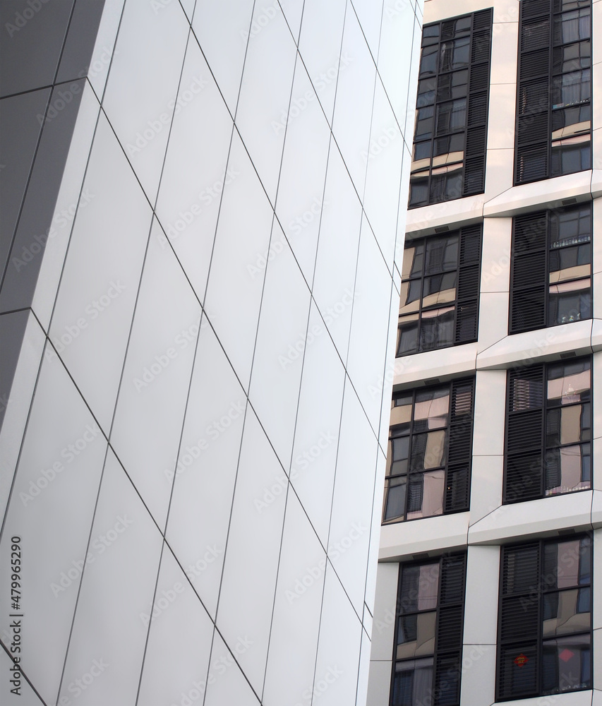 Vertical Cladding High Rise close up perspective detail of tall high rise modern apartment ...