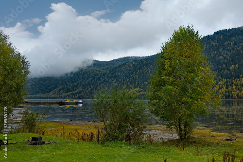 Russia. South of Western Siberia, Mountain Altai. Early autumn on the shore of Lake Teletskoye near the tourist village of Artybash.