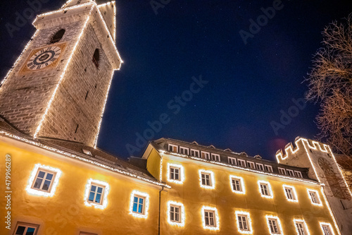 Strolling in the Christmas spirit of Brunico in the evening. photo