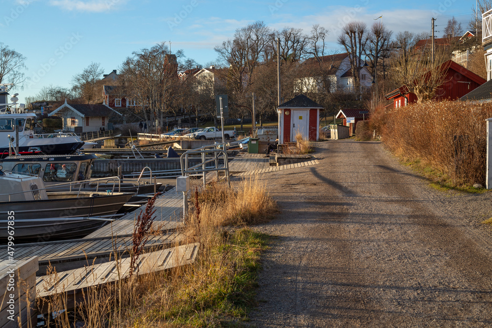 Winter day in a small harbour in Sweden. Rural road at Dalarö