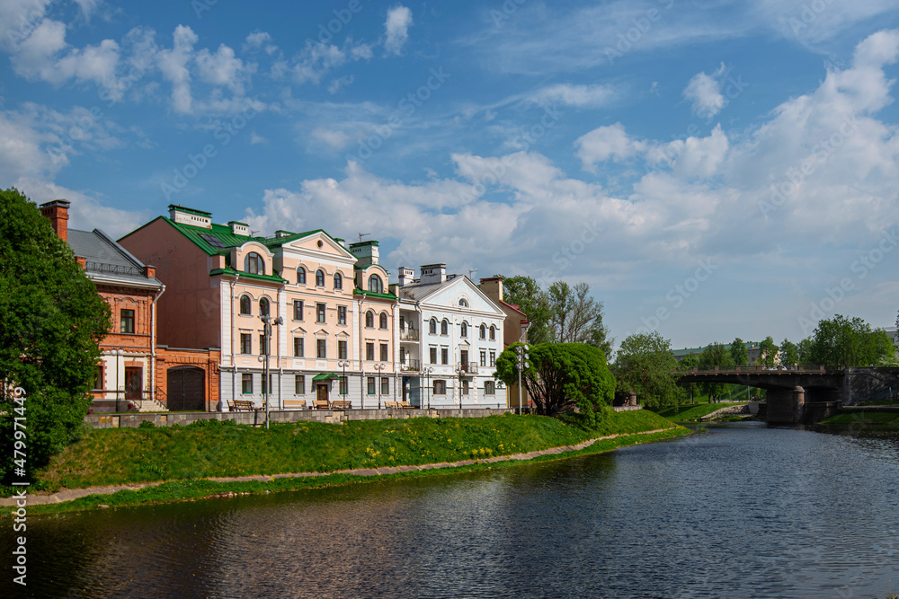 Summer sunny day. Embankment quarter on the bank of the river, a popular tourist destination, Pskov, Russia.