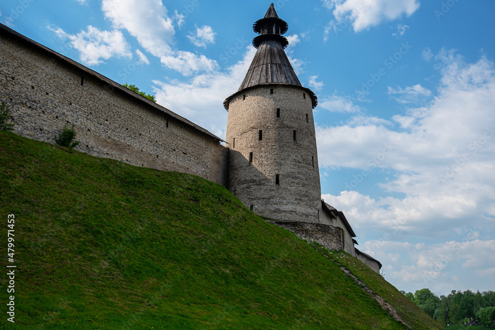 The fortress wall of the historical and architectural complex in the old city of Pskov preserved from the 12th century, Russia.