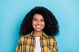 Photo of cheerful positive lovely lady toothy beaming smile wear checkered shirt isolated blue color background