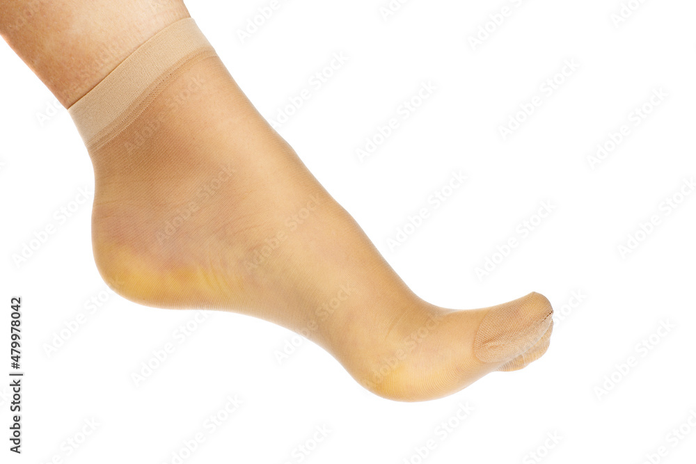Leg of beautiful young woman in sock isolated on a white background Leg of beautiful young woman in sock isolated on a white background