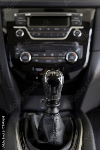 New modern unknown car with manual transmission. Modern transportation. Themed blur background. Close up. © tikhomirovsergey