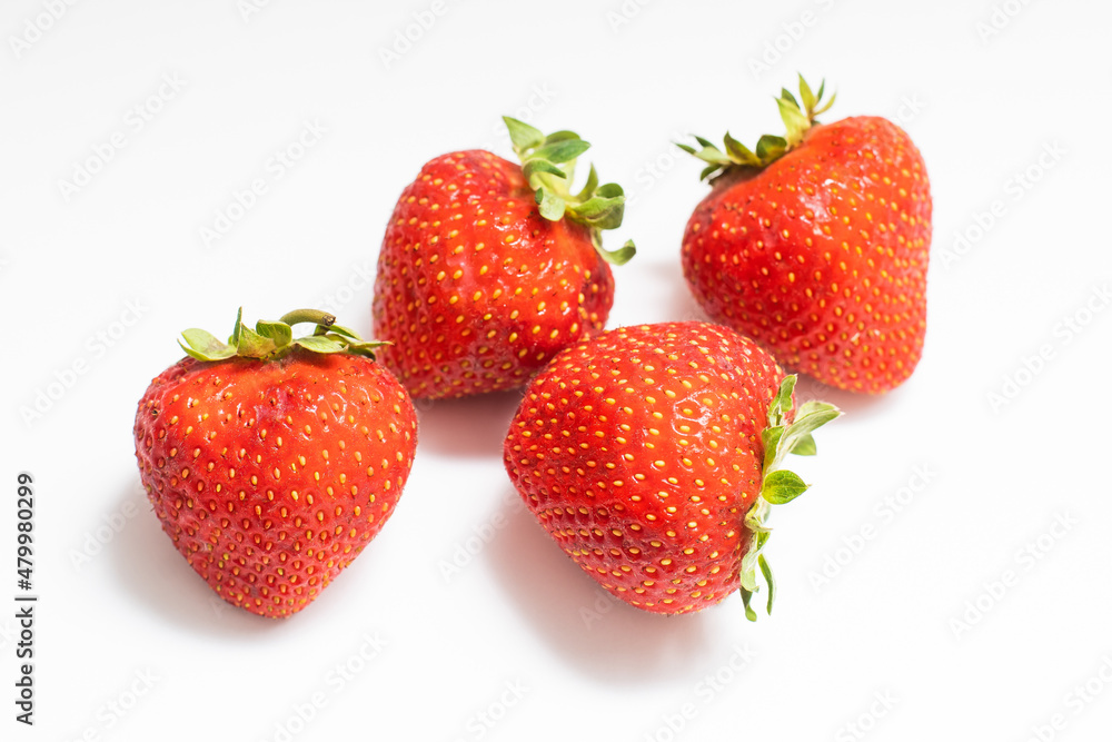 Ripe red strawberries on a white background Ripe red strawberries on a white background