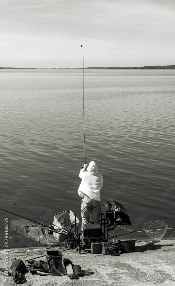 A man fishing with a rod A man fishing with a rod