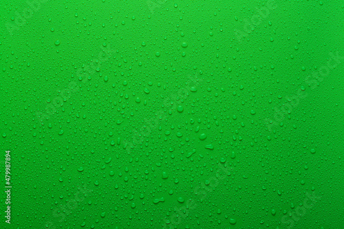 Water drops on green color surface
