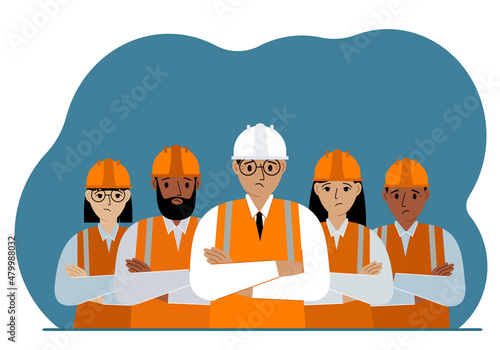 A team of sad construction workers in white and orange hard hats and orange vests. Engineer and builders. photo
