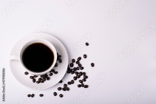 Cup of black coffee on white background top view