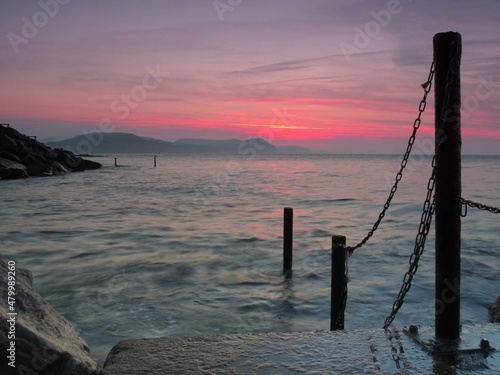 beautiful sunrise over the sea at Lyme Regis Dorset England 