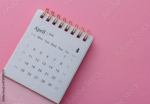 Calendar for April 2022 on a colored background.