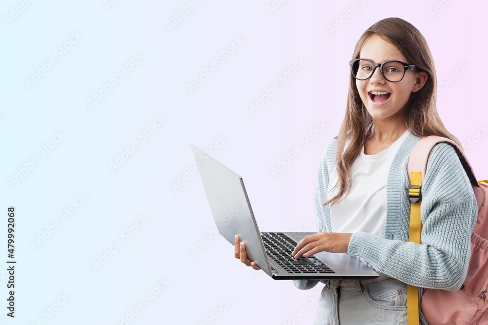 beautiful little girl uses a laptop at home beautiful little girl uses a laptop at home