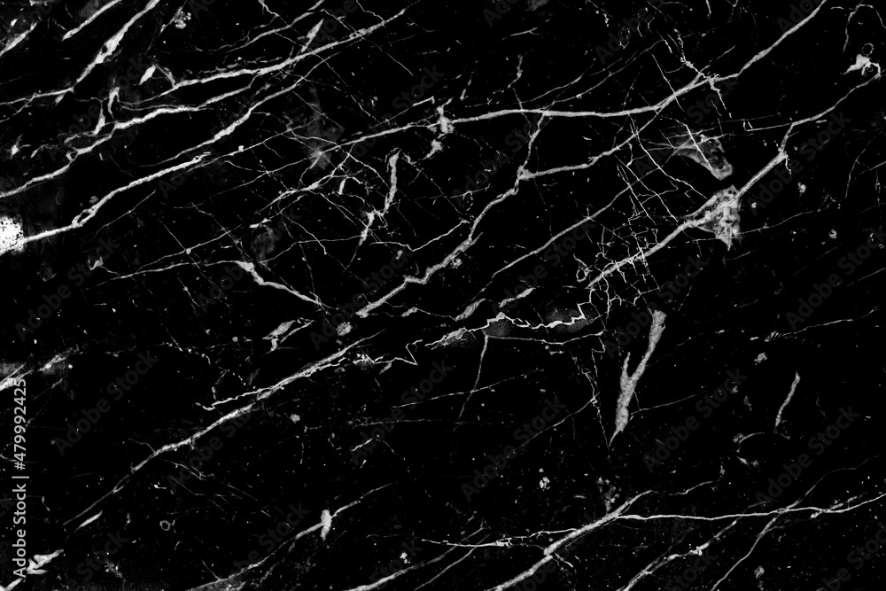 Black marble with abstract white pattern cracks surface grunge wall texture background
