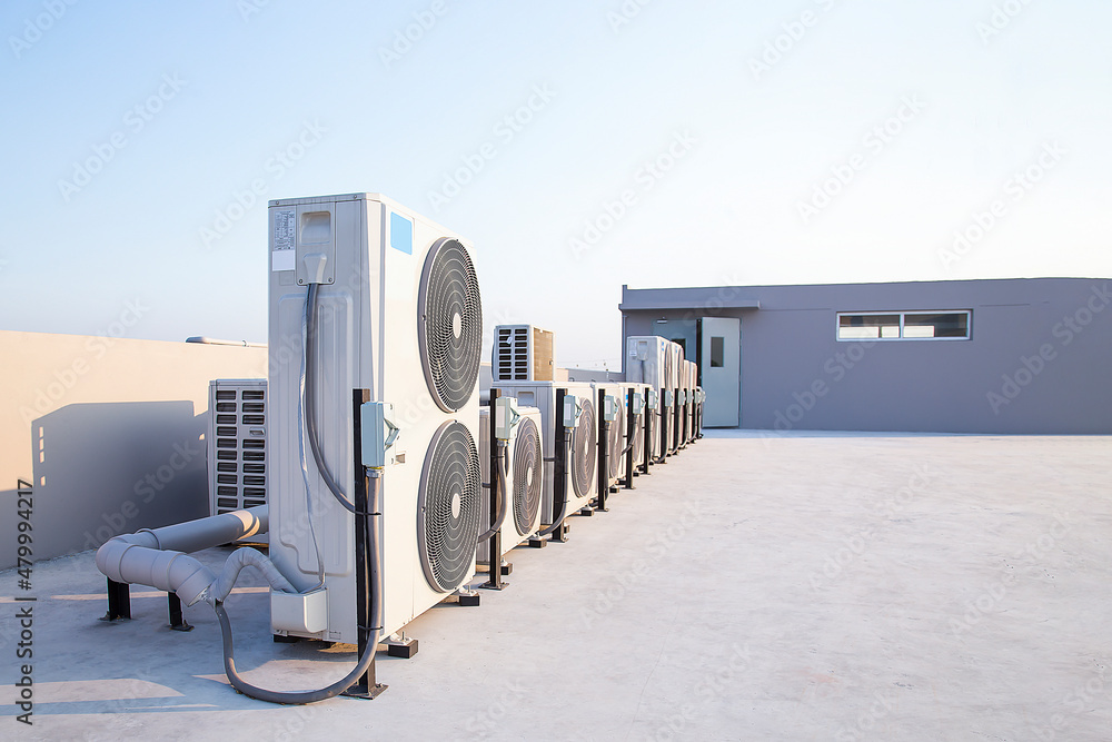 air condition outdoor unit compressor install outside the building. Stock  Photo | Adobe Stock
