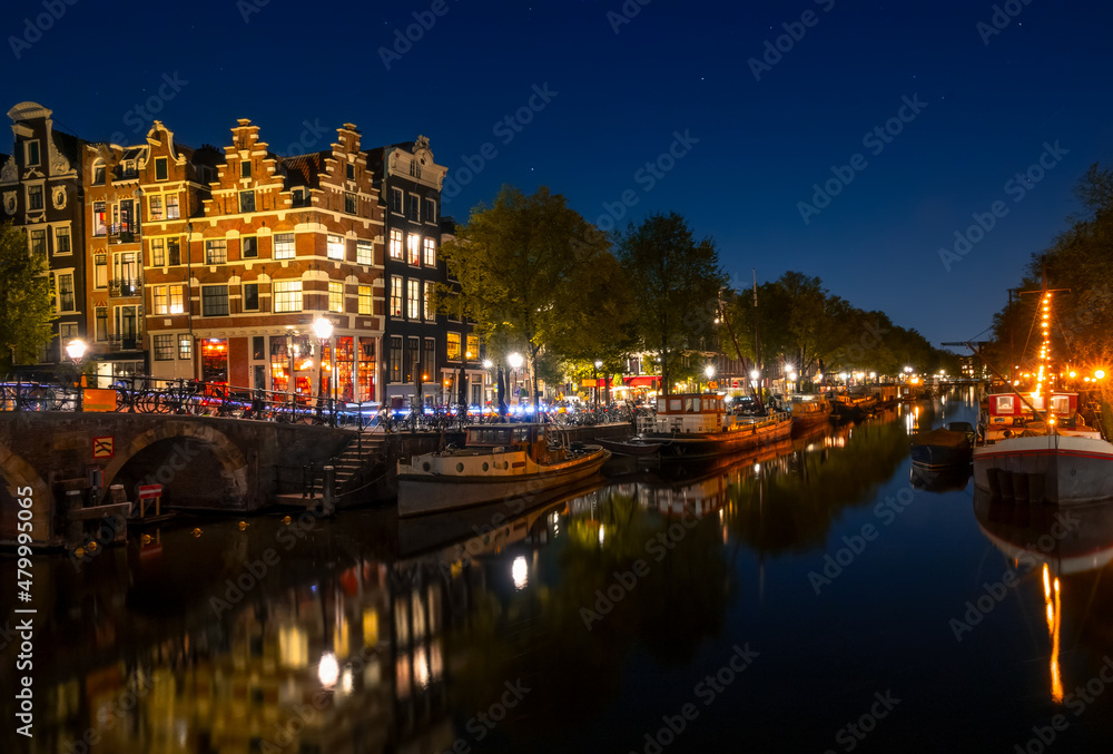 Amsterdam Canal With Boats on a Cloudless Night