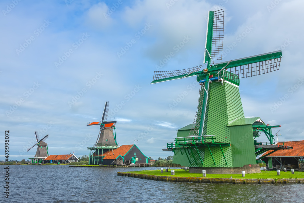 Three Dutch Windmills at the Waters Edge