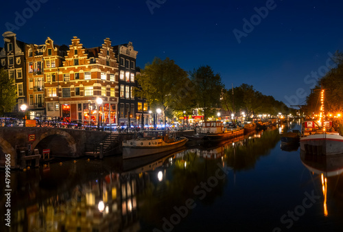 Amsterdam Canal With Boats on a Cloudless Night