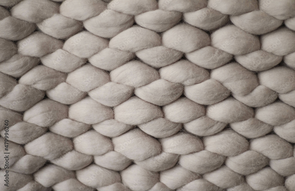 Light grey knitted background. inside of knitted woolen fabric. Neutral background of drawing Light grey knitted background. inside of knitted woolen fabric. Neutral background of drawing
