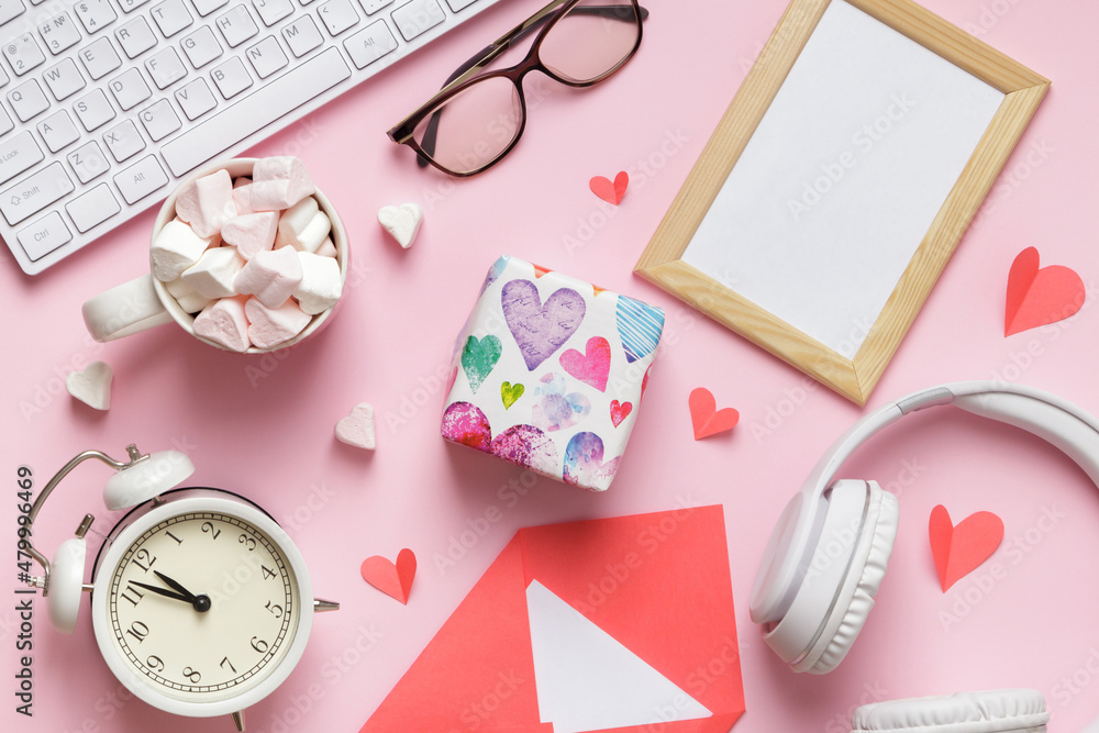 Valentine's day workplace. Frame envelope with gift marshmallow keyboard on pink table Top view flat lay Valentine's day workplace. Frame envelope with gift marshmallow keyboard on pink table Top view flat lay