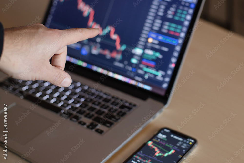 Man working with computer, laptop, thinking and analyzing graph stock market trading with stock chart data planning, financial and investment concept Man working with computer, laptop, thinking and analyzing graph stock market trading with stock chart data planning, financial and investment concept