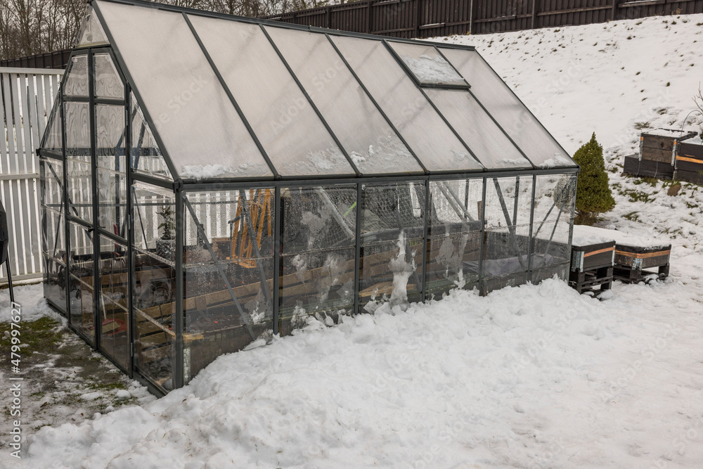 View of greenhouse with collected things for winter. Gardening concept. Sweden. View of greenhouse with collected things for winter. Gardening concept. Sweden.
