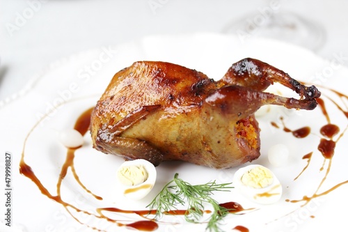 baked quail stuffed with corn grits and sun-dried tomatoes. holiday dish