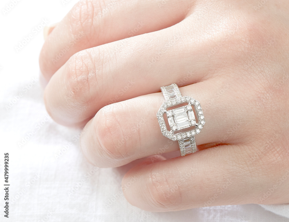 Jewelry background. Diamond ring on woman hand Jewelry background. Diamond ring on woman hand