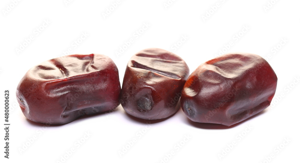 Pile fresh dates isolated on white Pile fresh dates isolated on white