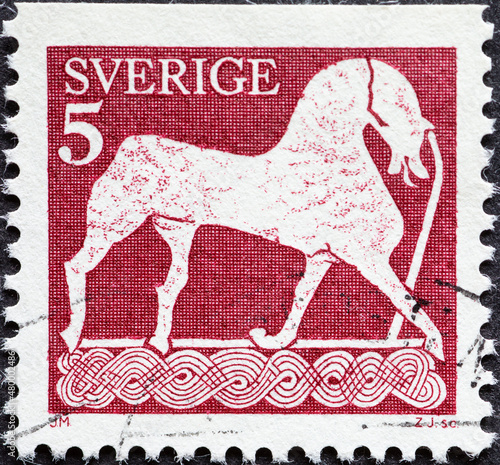 Sweden - circa 1976: a postage stamp from Sweden showing an artistic drawing of an ancient horse on Gottland in Sweden photo