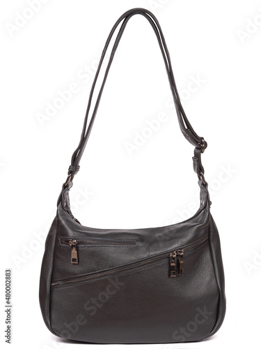 Small black leather woman's fashion handbag with strap isolated on white background