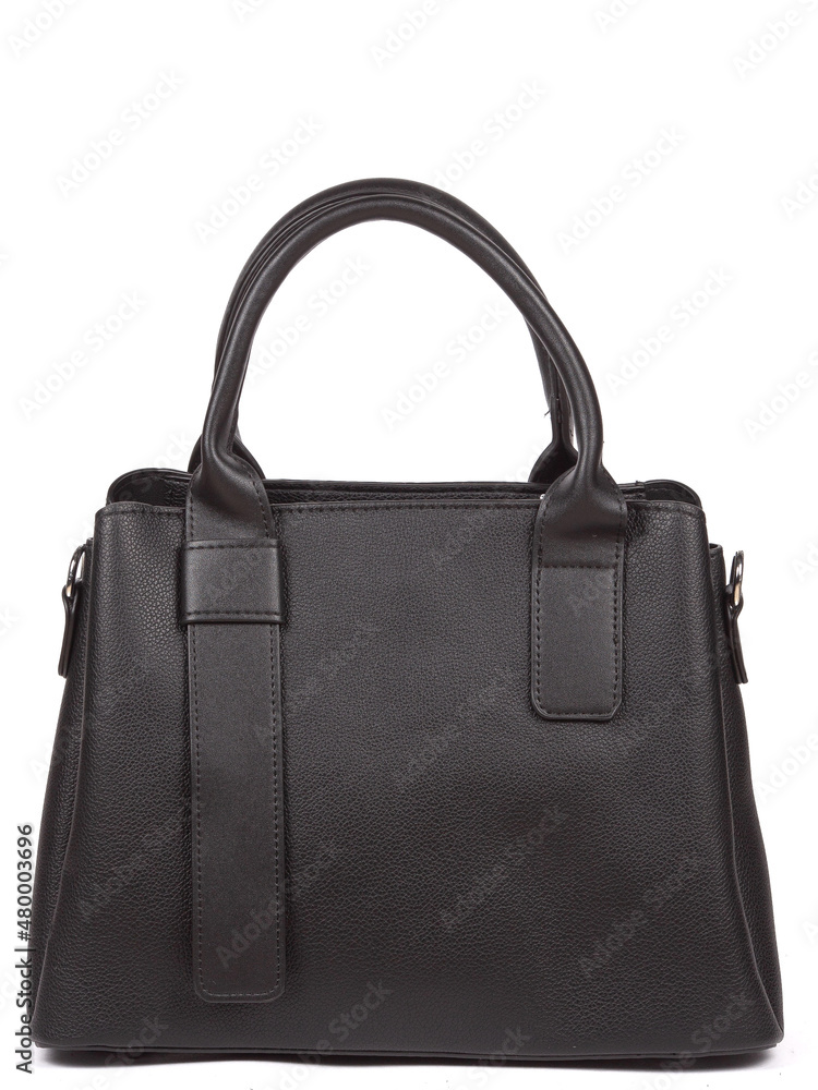 Black large with strap leather woman's handbag isolated on white background Black large with strap leather woman's handbag isolated on white background