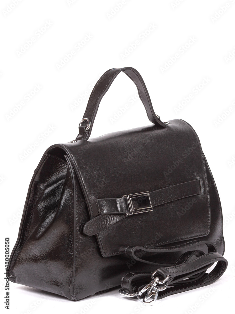 Small black leather woman's fashion handbag with strap isolated on white background Small black leather woman's fashion handbag with strap isolated on white background