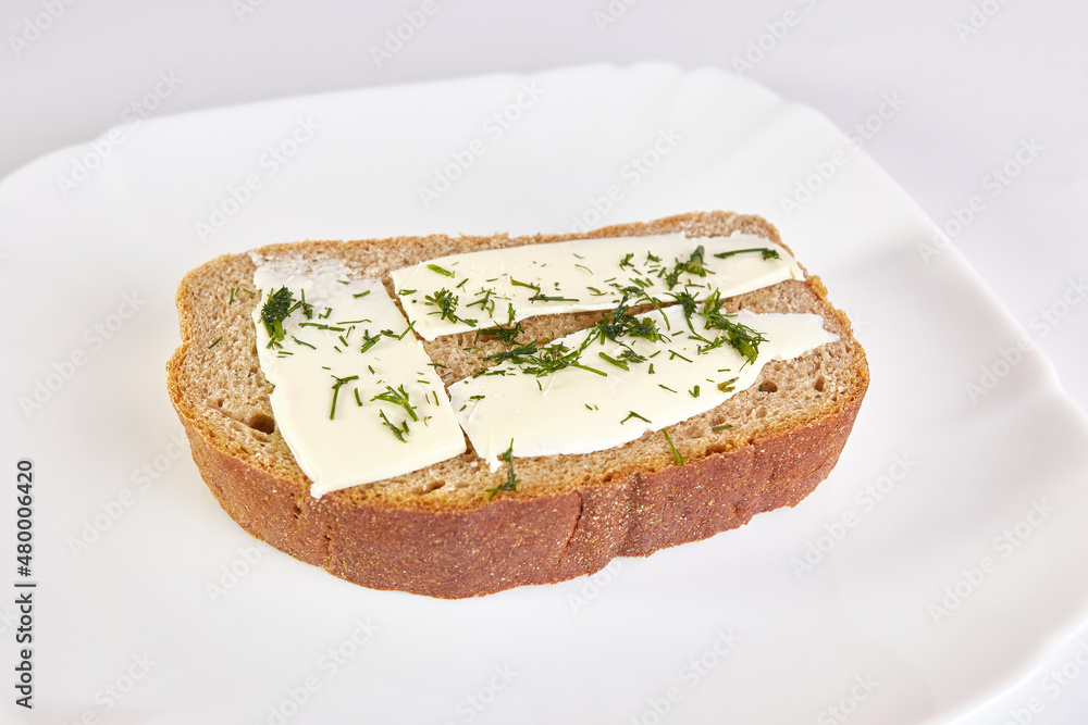 Sandwich of rye bread, butter and greens. Sandwich of rye bread, butter and greens.