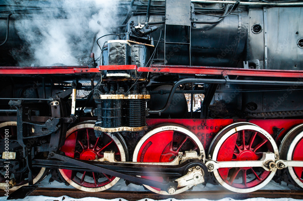 Steam engine on a locomotive. Old mechanisms Steam engine on a locomotive. Old mechanisms