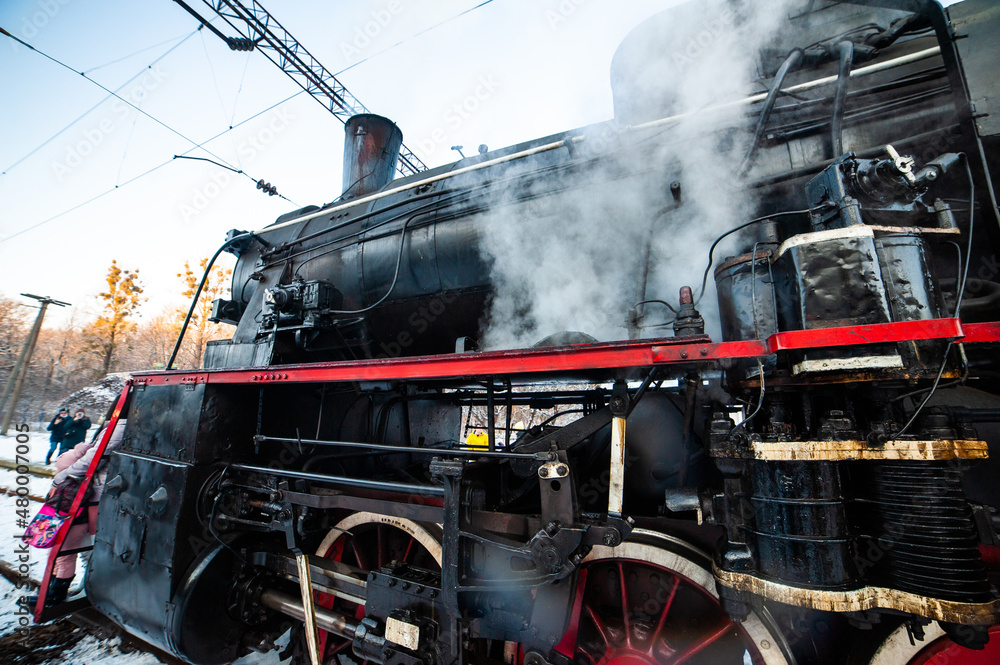 Naklejka premium Steam engine on a locomotive. Old mechanisms